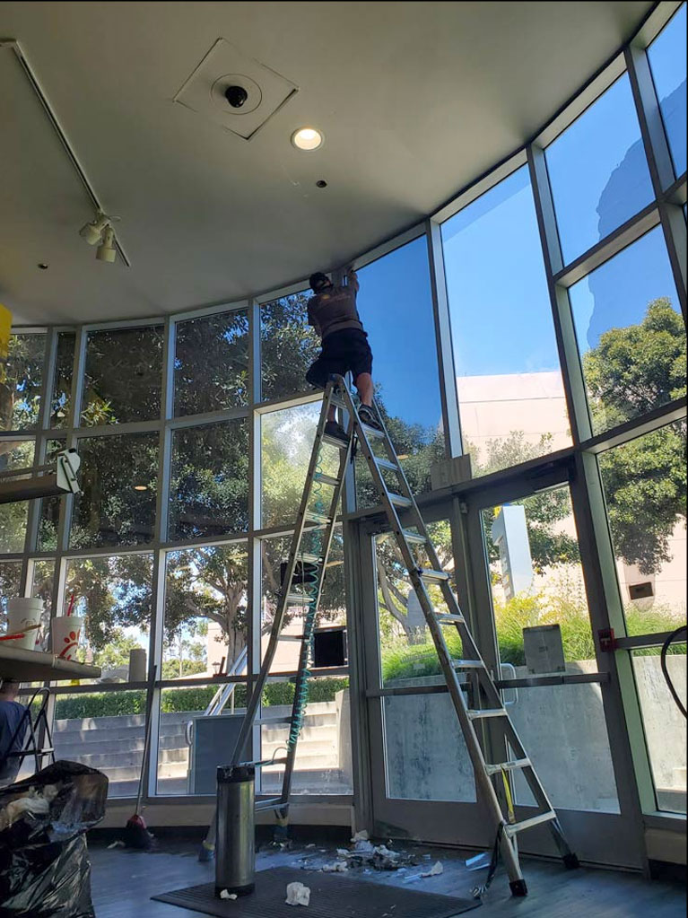 Big Hall with a Man Tinting Windows