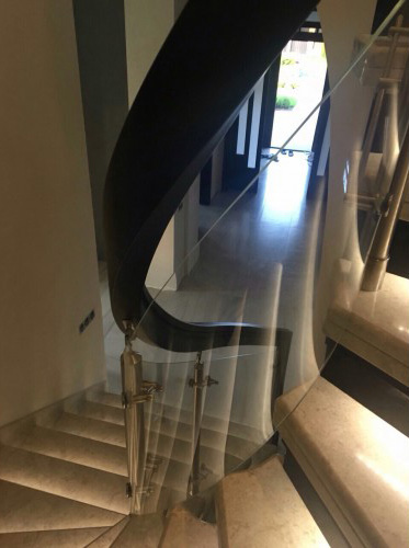 Curved glass stair railing