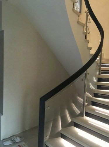 Curved glass stair railing