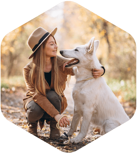 A Woman With A White Dog